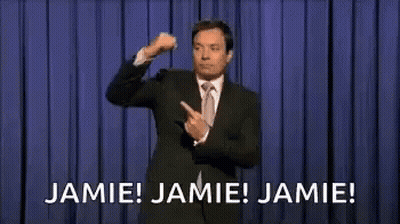 Man In Suit Pointing On Stage GIF