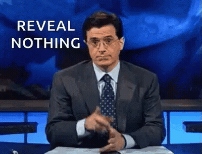Man In Suit Pointing Saying Reveal Nothing GIF
