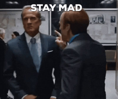 Man In Suit Pointing Saying Stay Mad GIF