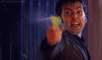 Man In Suit Pointing Toy Gun At Camera GIF