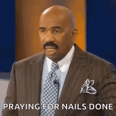 Man In Suit Praying During TV Show GIF