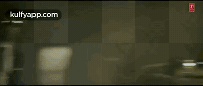 Man In Suit Punched By Another Man In Crowd GIF