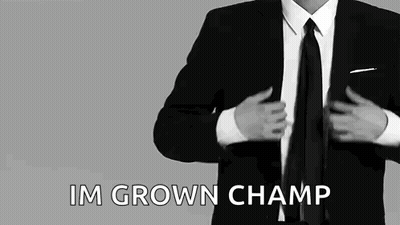 Man In Suit Putting On Jacket And Tie GIF