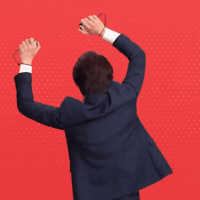 Man In Suit Raising Arms GIF