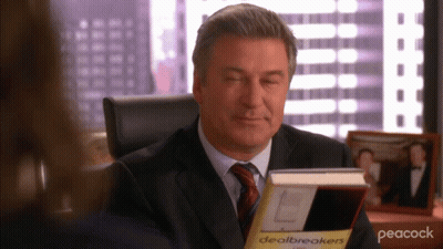 Man In Suit Reading Dealbreakers GIF