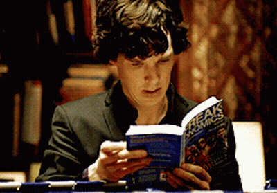 Man In Suit Reading Freak Comics GIF