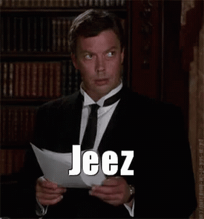 Man In Suit Reading Paper Saying Jeez GIF