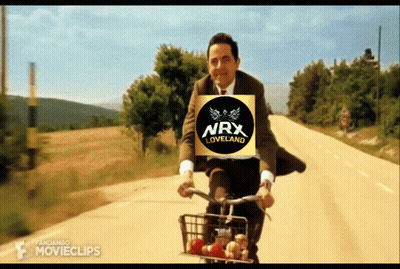 Man In Suit Riding Bike With NRX Loveland Logo GIF