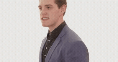 Man In Suit Running And Making Face GIF