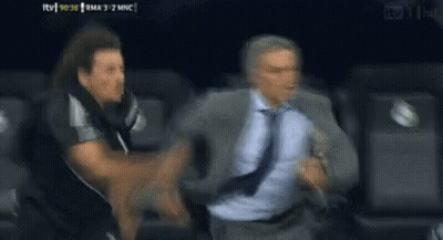 Man In Suit Running From Man In Black Shirt GIF