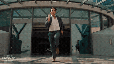 Man In Suit Running Past Mission Impossible Building GIF