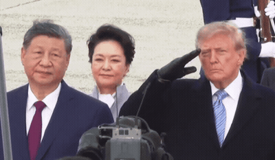 Man In Suit Saluting Beside Woman GIF