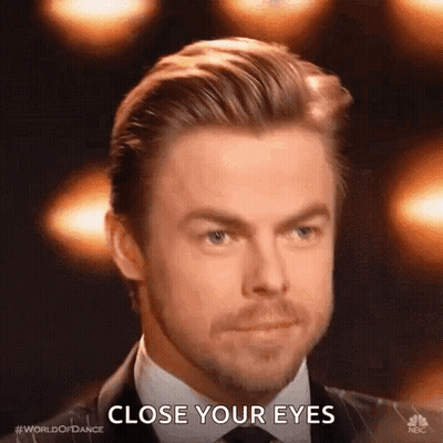 Man In Suit Saying Close Your Eyes GIF