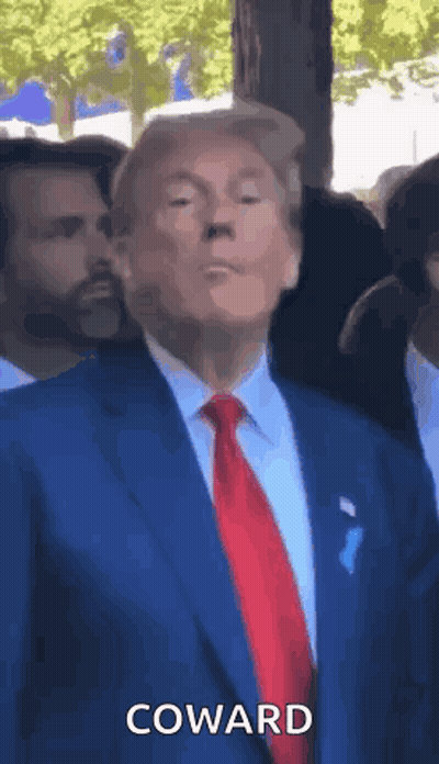 Man In Suit Saying Coward To Crowd GIF