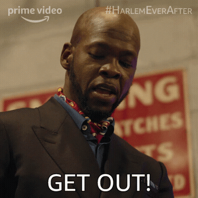 Man In Suit Saying Get Out In Front Of Red Sign GIF