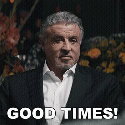Man In Suit Saying Good Times With Flowers GIF