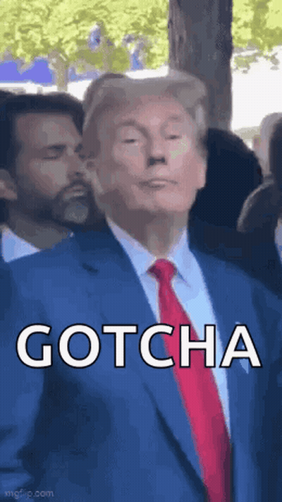 Man in Suit Saying Gotcha to Crowd