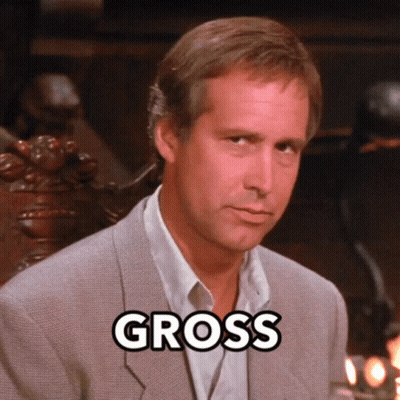 Man In Suit Saying Gross GIF