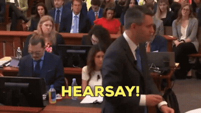 Man In Suit Saying Hearsay In Yellow Letters GIF