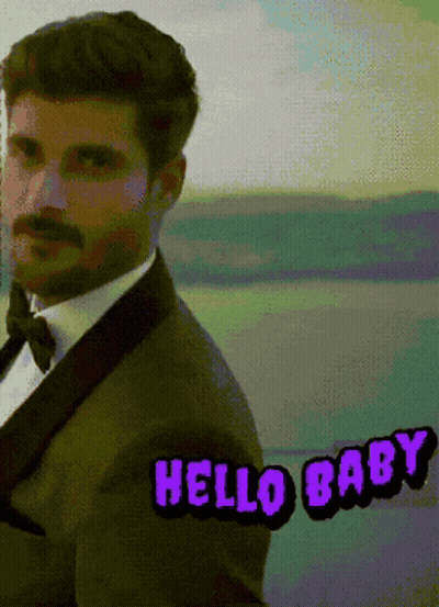 Man In Suit Saying Hello Baby In Purple GIF