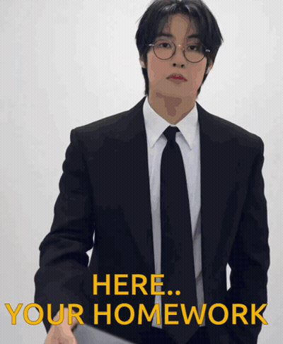 Man In Suit Saying Here Your Homework GIF