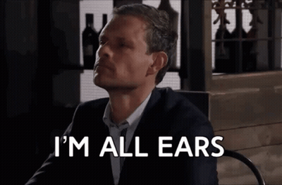 Man In Suit Saying I'm All Ears GIF