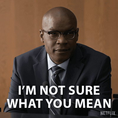Man In Suit Saying I'm Not Sure What You Mean GIF