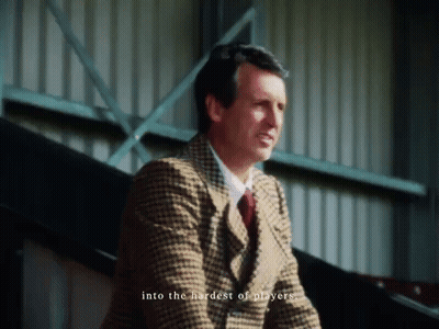 Man In Suit Saying Into The Hardest Of Players GIF