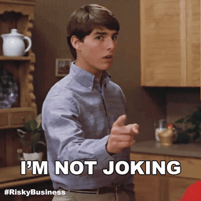 Man In Suit Saying It's Not A Joke Holding Paper GIF