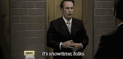Man In Suit Saying It's Showtime Folks GIF