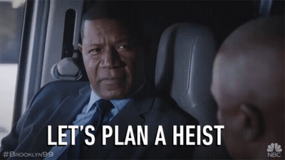 Man In Suit Saying Let's Plan A Heist In A Car GIF