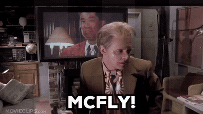 Man In Suit Saying McFly In Front Of TV GIF