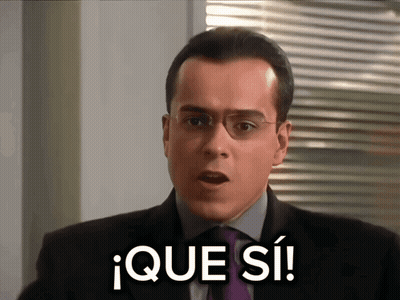 Man In Suit Saying Que Si GIF