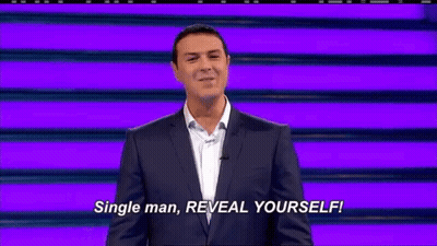 Man in Suit Saying Reveal Yourself