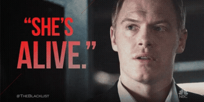 Man In Suit Saying She's Alive In Red GIF