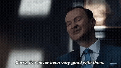 Man In Suit Saying Sorry I've Never Been Very Good With Them GIF