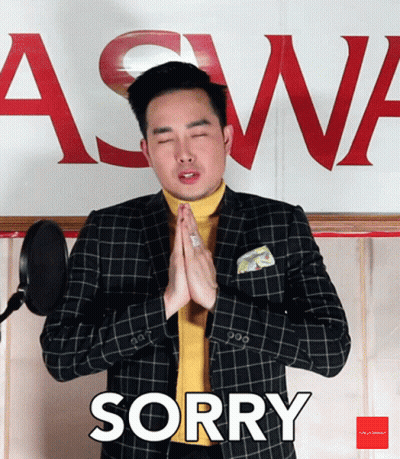 Man In Suit Saying Sorry In Front Of Aswa Sign GIF