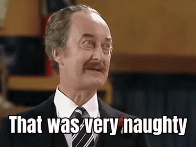 Man In Suit Saying That Was Very Naughty GIF