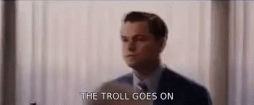 Man In Suit Saying The Troll Goes On GIF