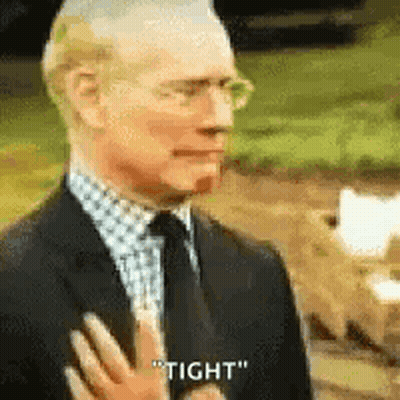 Man In Suit Saying Tight Hand To Chest GIF