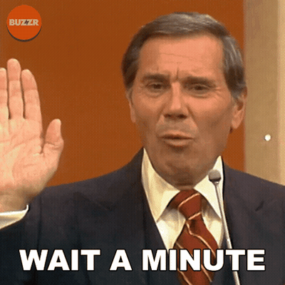 Man In Suit Saying Wait A Minute GIF