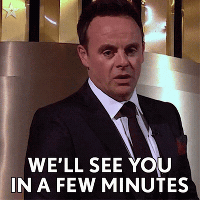 Man In Suit Saying We'll See You In A Few Minutes GIF