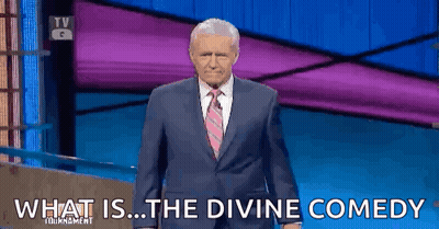 Man In Suit Saying What Is The Divine Comedy In Front Of Purple Wall GIF