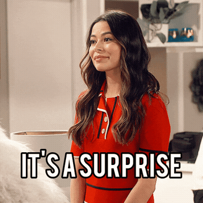 Man In Suit Saying Who Doesn't Love A Good Surprise GIF