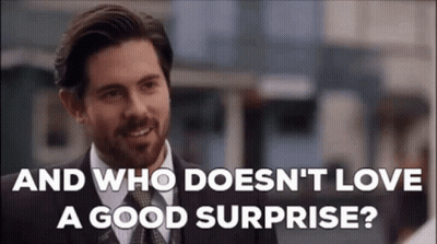 Man In Suit Saying Who Doesn't Love A Good Surprise GIF