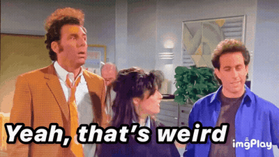 Man In Suit Saying Yeah That's Weird Next To Two Men GIF