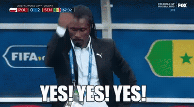 Man in Suit Saying Yes in Front of FIFA Logo