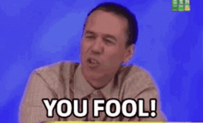 Man in Suit Saying You Fool