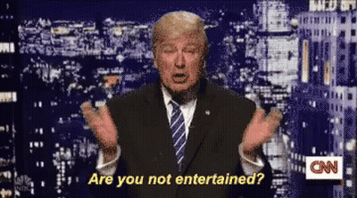 Man In Suit Says Are You Not Entertained GIF