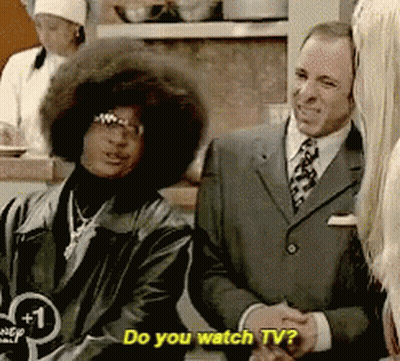 Man In Suit Says Do You Watch TV Next To Woman GIF